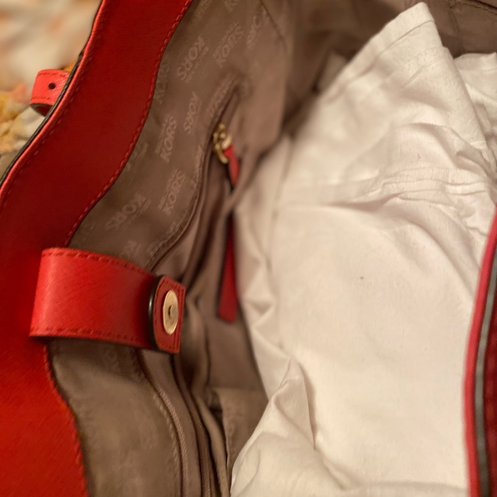 Michael Kors shoulder bag, coral in color.